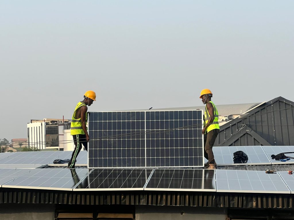 Sunnovate engineers installing solar panels on a rooftop