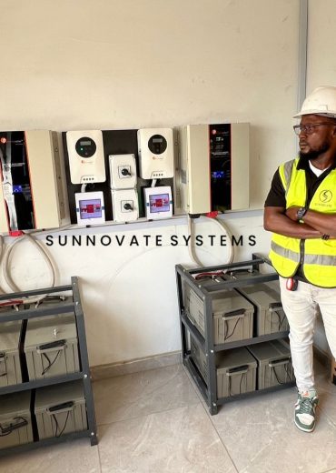 Sunnovate engineer beside inverters and a battery rack
