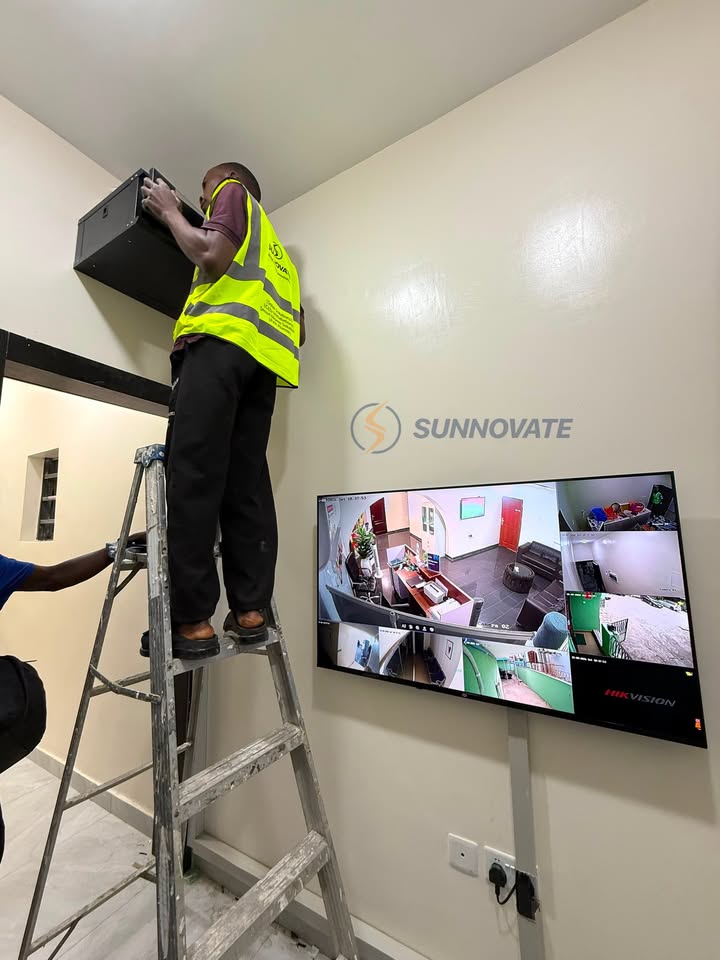 Technician installing a CCTV monitor