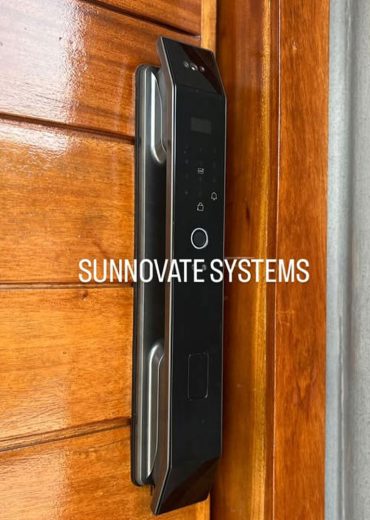 Smart door lock with fingerprint reader on a wooden door